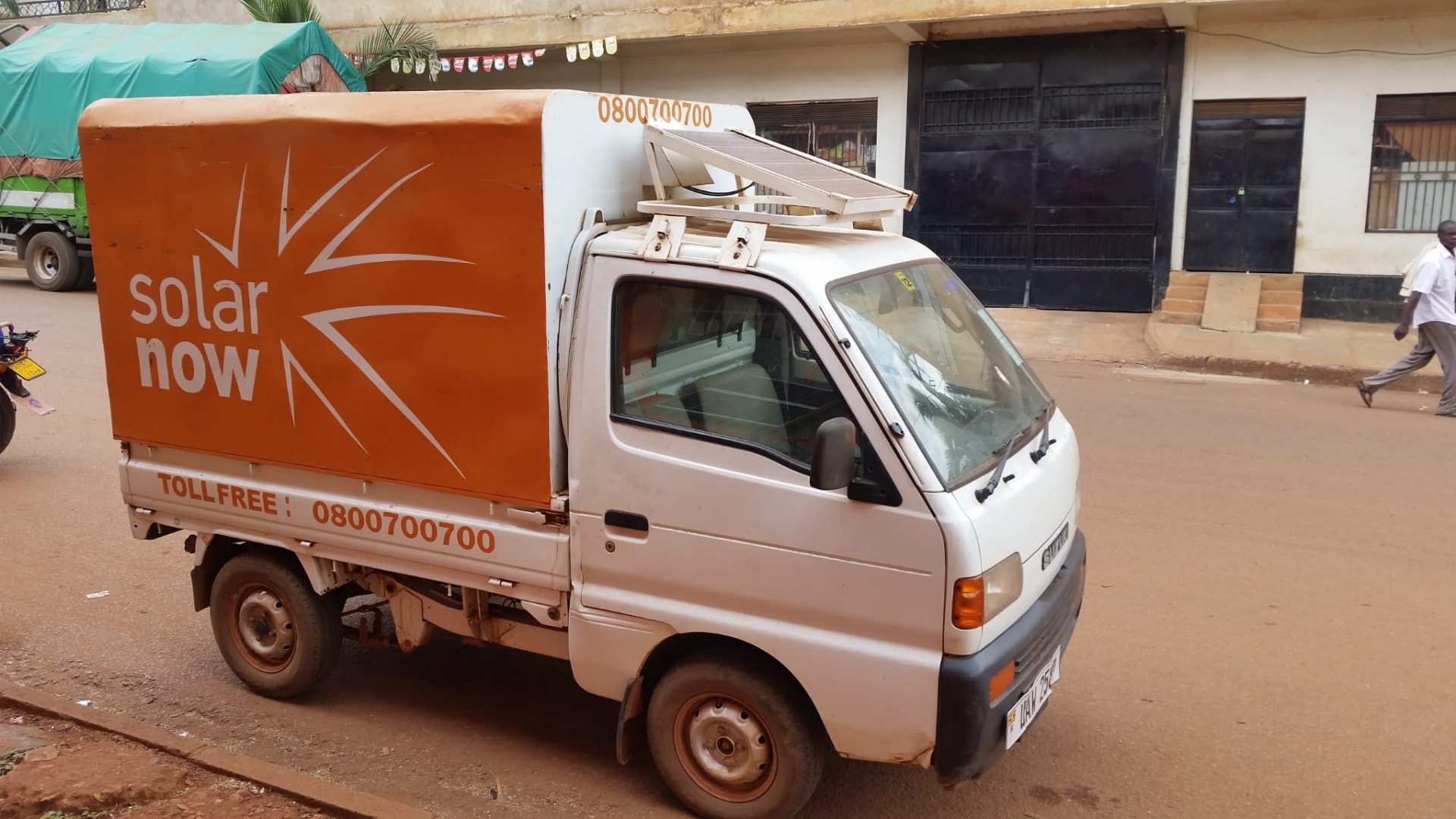 Off-grid solar installation service vehicle with a roof-mounted PV panel