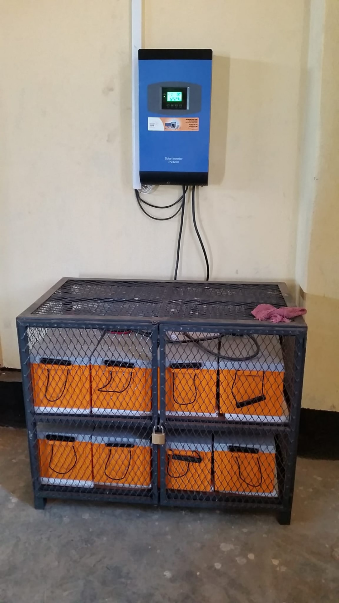 Off-grid solar inverter with a secured battery bank in a steel cage